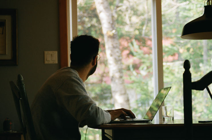 man looking at window remote employees