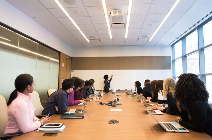people having a meeting with one person presenting