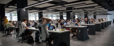 office full of employees for outsourcing purposes